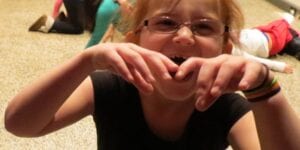 A little girl is playing at the Auburn Public Theater.