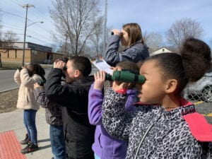 At Baltimore Woods, kids are trying out binoculars.