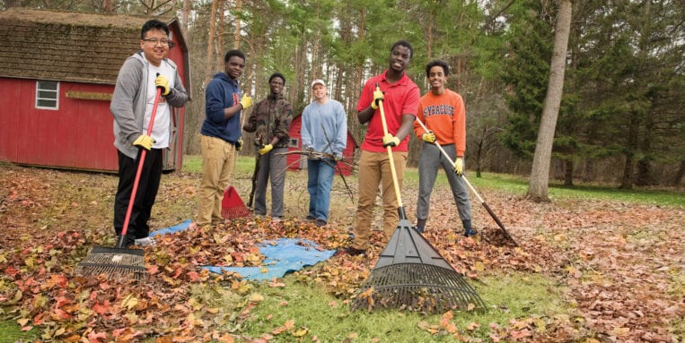 Building Men teens volunteer to rake leaves