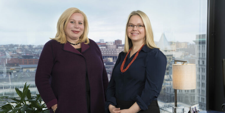 Christine Dettor and Emilee Hatch standing in their office