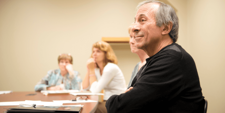 At Downtown Writers' Group, students listen in the classroom.