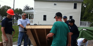 Volunteers help construct a Habitat for Humanity home.