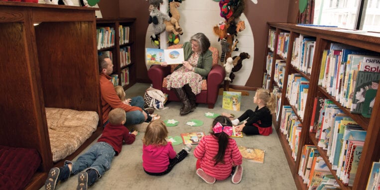 Children listen in a reading circle at Earlville Library