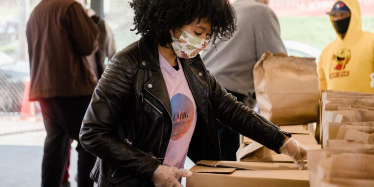 Women packing food into box