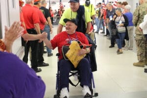 Veteran sitting in wheelchair at the airport during honor flight mission