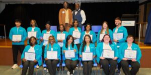 Group of people holding awards