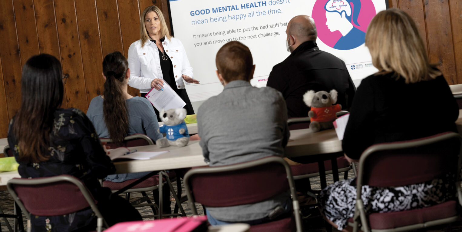 Woman presenting to a group of people