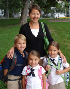 Delisa Kerwin stands with her children outside