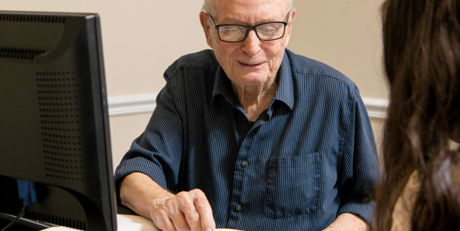 Man pointing to piece of paper