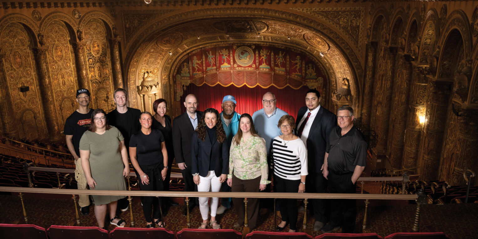 Group of people standing in theater