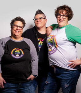 3 women standing next to eachother