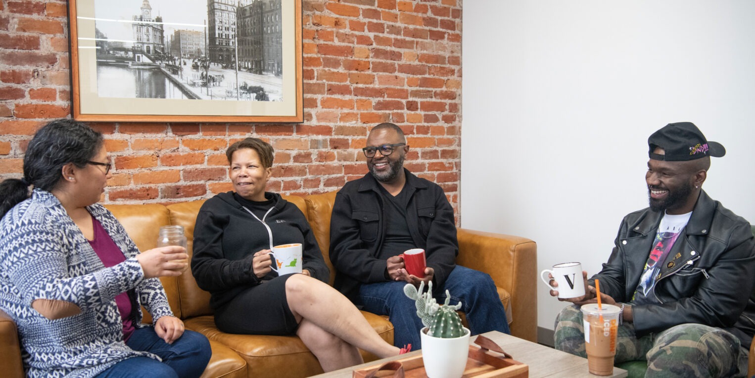 Group of meeting sitting and talking