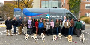 Group of people standing in front of a van