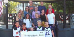 Group of people holding a check