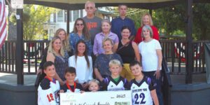 Group of people holding a check