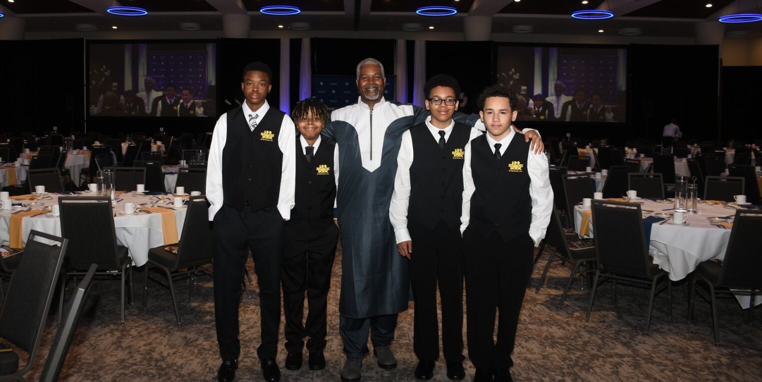 Man standing with group of boys