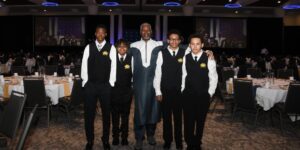 Man standing with group of boys