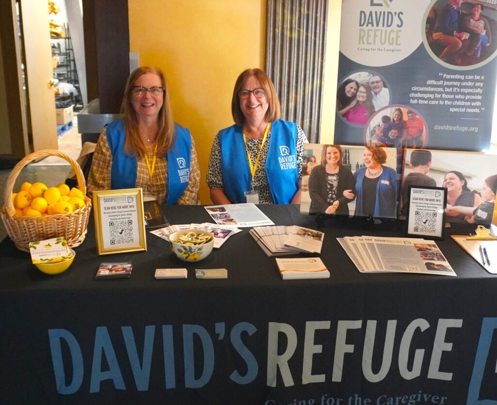 2 People Sitting at David's Refuge Table Display 