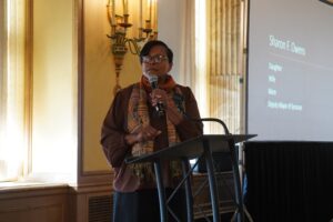 Woman speaking into microphone