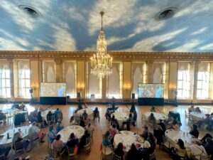 Conference Room, People Sitting at Tables