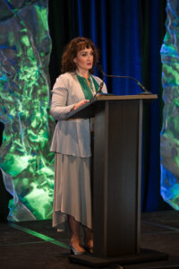 Woman Standing at Podium