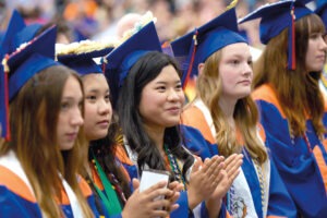 Students sitting in the audience at a graduation