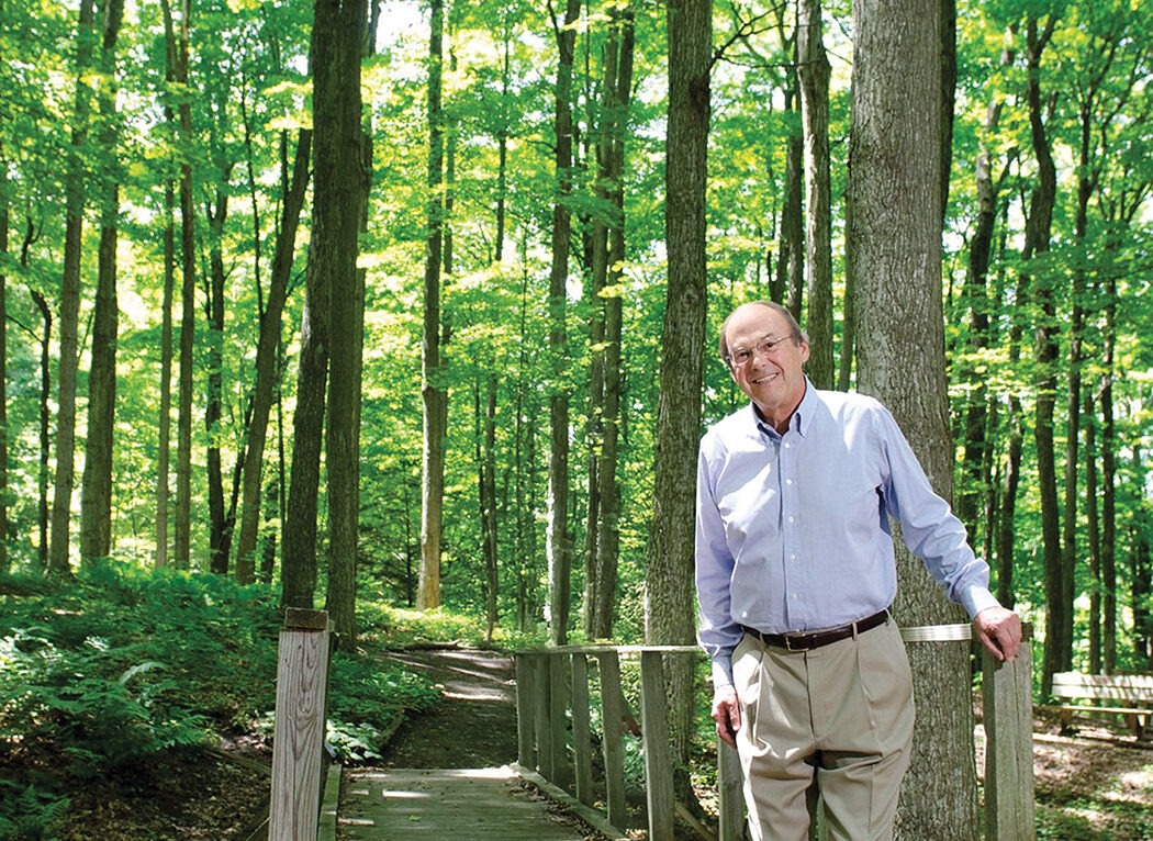 John Marsellus standing in the woods